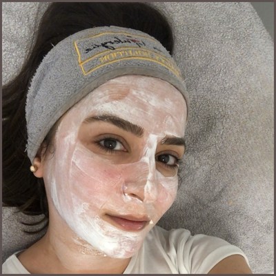 Me with a face mask during a facial